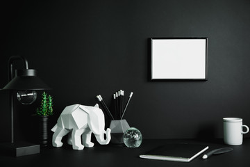 Black design room with mock up photo frame, elephant figures, tropical plant and office...