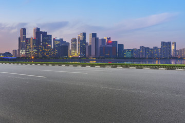Urban road asphalt pavement and skyline of Hangzhou architectural landscape