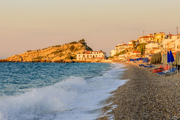 Fototapeta na wymiar Kokkari beach is a picturesque beach in Kokkari village, beautiful sunset view, Samos island, Greece