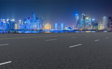 Urban road asphalt pavement and skyline of Hangzhou architectural landscape