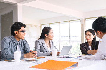 Business groups are helping to analyze the market in the last quarter of the company. They work together as a team.