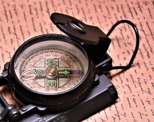 black metal compass with phosphorus arrows
