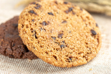 Chocolate cookies on wooden table.