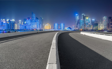 Urban road asphalt pavement and skyline of Hangzhou architectural landscape