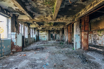 Fototapeta na wymiar Dark interior of empty abandoned factory