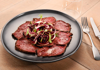 Sliced roast beef with radicchio salad