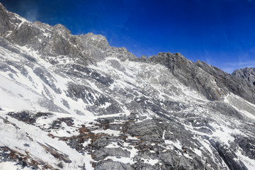 Looking up at the majestic and snowy mountain top, in Yulong Snow Mountain, Lijiang City, Yunnan Province, China