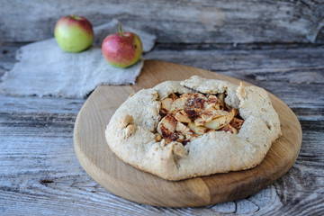 biscuits with apples and cinnamon on a wooden table