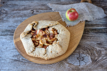 biscuits with apples and cinnamon on a wooden table