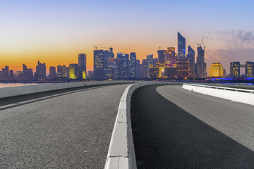 Fototapeta premium Urban road asphalt pavement and skyline of Hangzhou architectural landscape