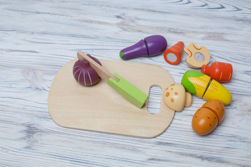 toy vegetables.
children's developing wooden game.
a set of wooden vegetables.
game in chef.
children's board game
