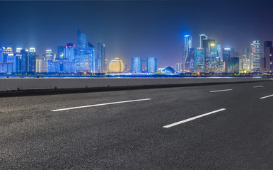 Urban road asphalt pavement and skyline of Hangzhou architectural landscape