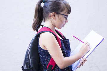 portrait of student painting on notebook outdoor