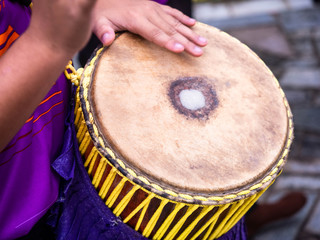 drummer use hand to drum on tom-tom(a tall narrow drum) in festival
