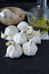 group of garlic heads on black background