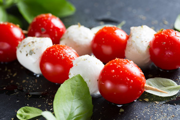 Mozzarella and cherry tomatoes on skewers