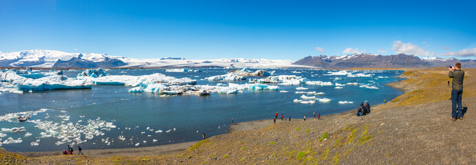 Wonderful view of Glacier Lagoon, Jokulsarlon, on South Iceland and hikers