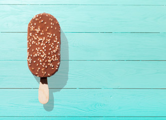 Ice cream sticks closeup on blue rustic wood background