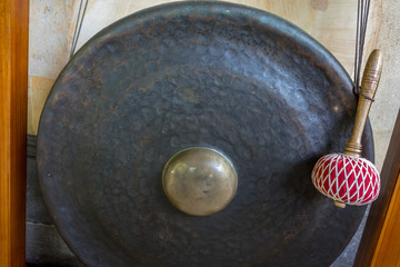 metal gong with wood handle, asian instrument