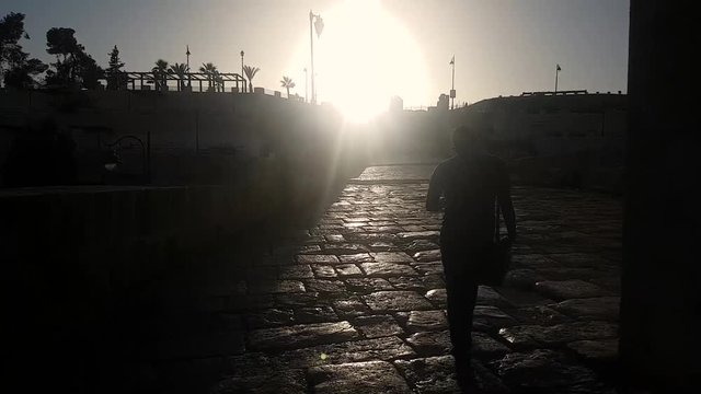 guy taking selfies while walking in old path in jarash