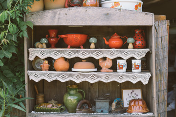 Obraz na płótnie Canvas garden, kitchen tools and flowerpots on wood shelf background with vintage feel