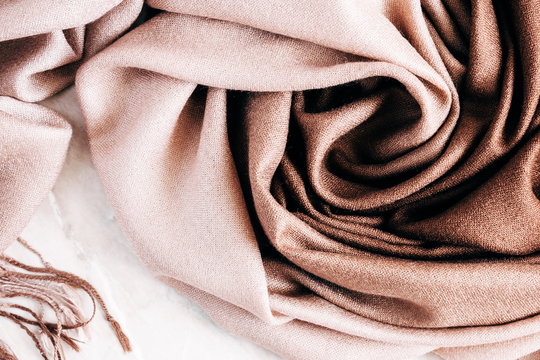 Autumn background. Beautiful elegant brown scarf. Flat lay, top view 
