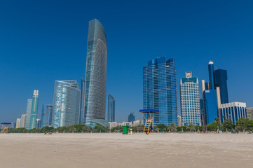 Fototapeta na wymiar Abu Dhabi - like in the nearby Dubai, in Abu Dhabi there is a very rich skyline. Here in particular the sky scrapers of the Corniche Beach