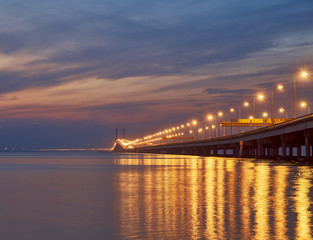Fototapeta na wymiar The Penang bridge against the background of colourful dawn