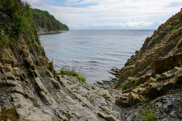 Fototapeta na wymiar Access to the beach through the rock. Coast of the Black Sea, Tuapse Russia