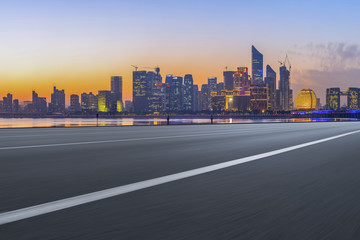 Urban road asphalt pavement and skyline of Hangzhou architectural landscape