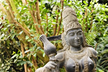 Fototapeta na wymiar The Buddhist goddess Parvati is sitting in a meditative pose, South India, Tamilnadu, XX century