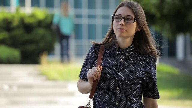 Student girl leave from univercity after lessons