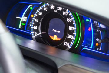 Close up empty Petrol, gasoline gauge dash board in car with digital warning sign of run out of...