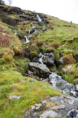 Fototapeta na wymiar Waterfall and river at Ystad Ybytsy Estate in Wales - United Kingdom