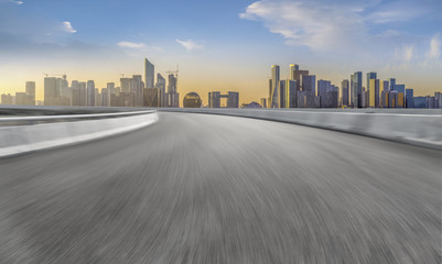 Obraz premium Urban road asphalt pavement and skyline of Hangzhou architectural landscape