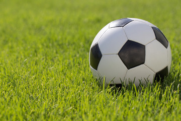 Traditional soccer ball on soccer field