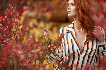 Autumn woman in autumn scene Warm sunny weather. Fall concept