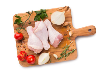 Chicken legs on wooden board isolated