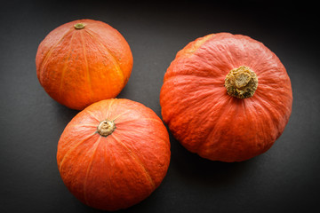 Pumpkins on dark background.