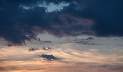 Abstract nature background. Dramatic and moody pink, purple and blue cloudy sunset sky.
