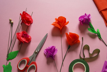 making crepe paper flowers on pink background