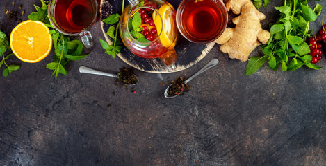 Top view of tea set on dark background