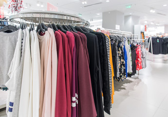 Various shop clothing in ladies' clothing store in summer