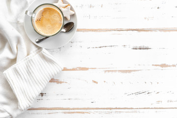 Top view of cappuccino on white wooden table