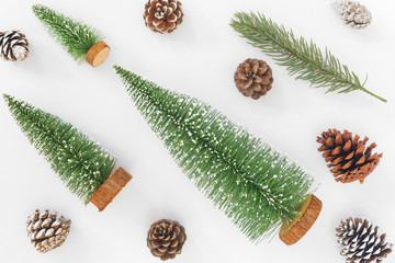 Christmas pattern made of christmas tree, pine cones and fir leaves on white background. Creative flat lay, Creative flat lay, top view design