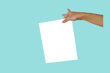 The hands are holding white paper on a pastel tone backgrounds.