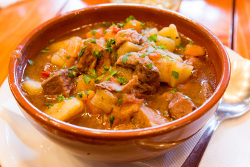 clay bowl with traditional hungarian food goulash 