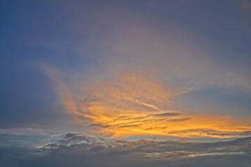 Fototapeta premium Beautiful white and gray clouds against the blue sky. Summer and autumn day with a view from the airplane to the atmosphere. Stock Photo for design