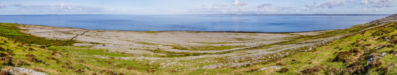 Panorama of Fanore beach in Burren mountain with Galway bay in background