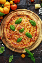 Stone Baked Pizza margherita with farm tomatoes sauce, parmesan and mozzarella cheese, basil
